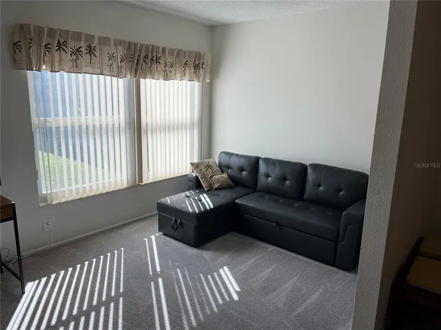 a view of a garden with an outdoor seating