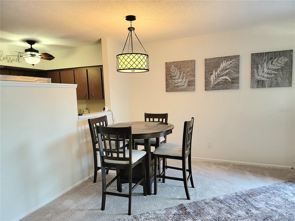 2371 Israeli Drive, Unit 39 Clearwater, FL 33763 - Photo 5 of 34 a view of a dining room with furniture