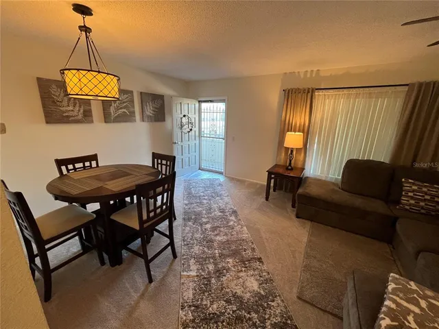 a kitchen with stainless steel appliances granite countertop a refrigerator stove and sink