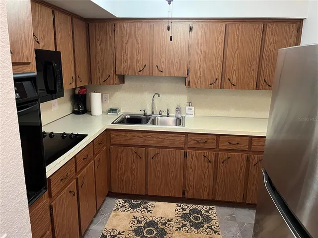 a bedroom with a bed and a ceiling fan