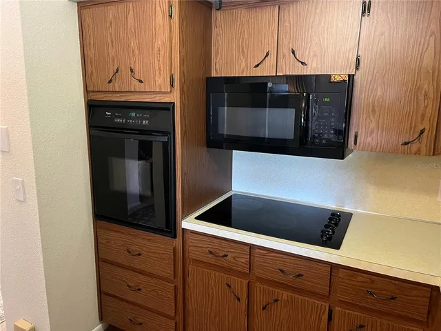 a bed room with a bed and a ceiling fan