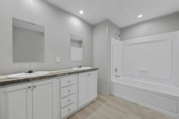 a bathroom with a granite countertop sink mirror and a