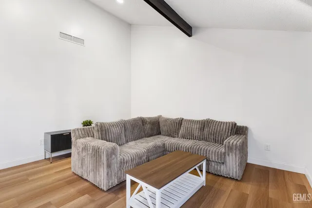 a living room with furniture and a couch