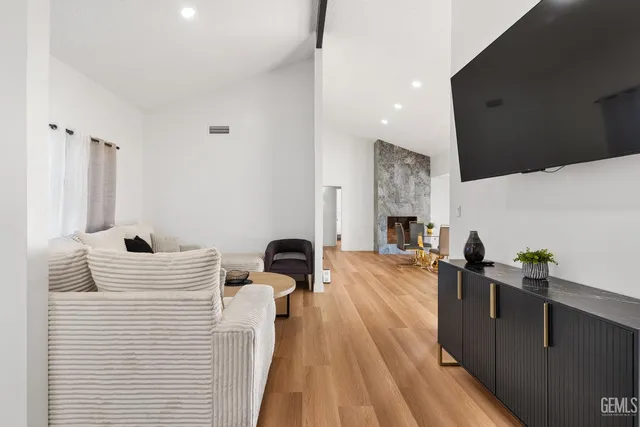 a living room with furniture and a fireplace