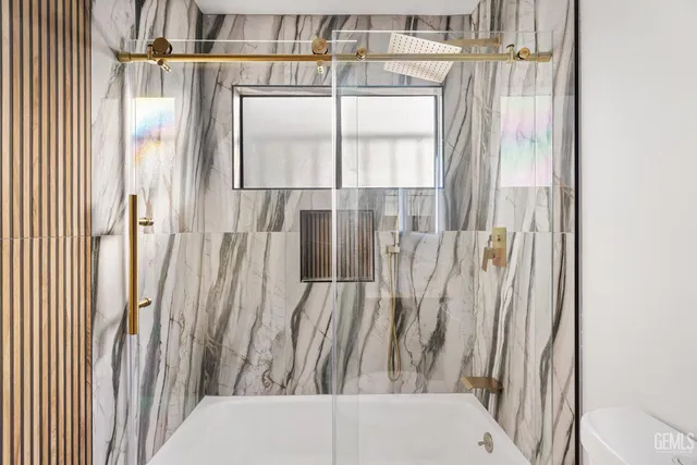 a view of a balcony with wooden floor and door