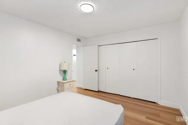 a large white bed in a white room