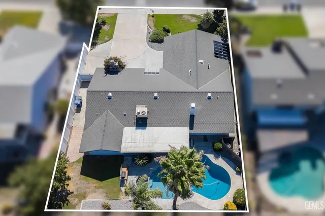 an aerial view of a house with swimming pool
