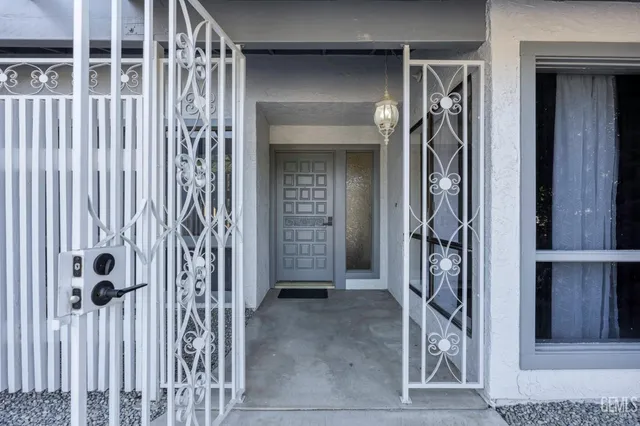 a view of a porch with a door and a window