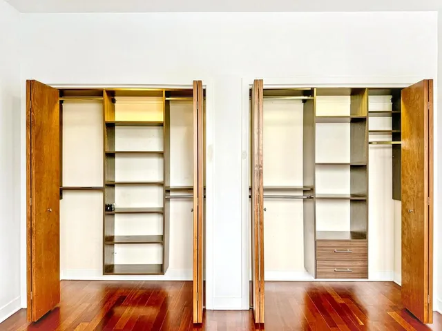 a view of room with window and wooden floor