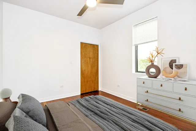 a bedroom with a bed and cabinets