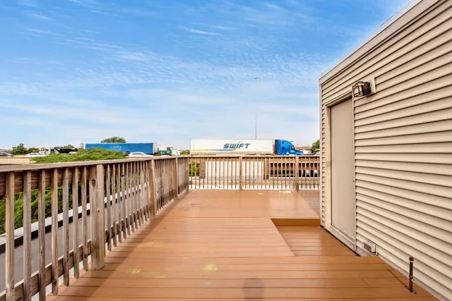 a view of a balcony with an outdoor seating