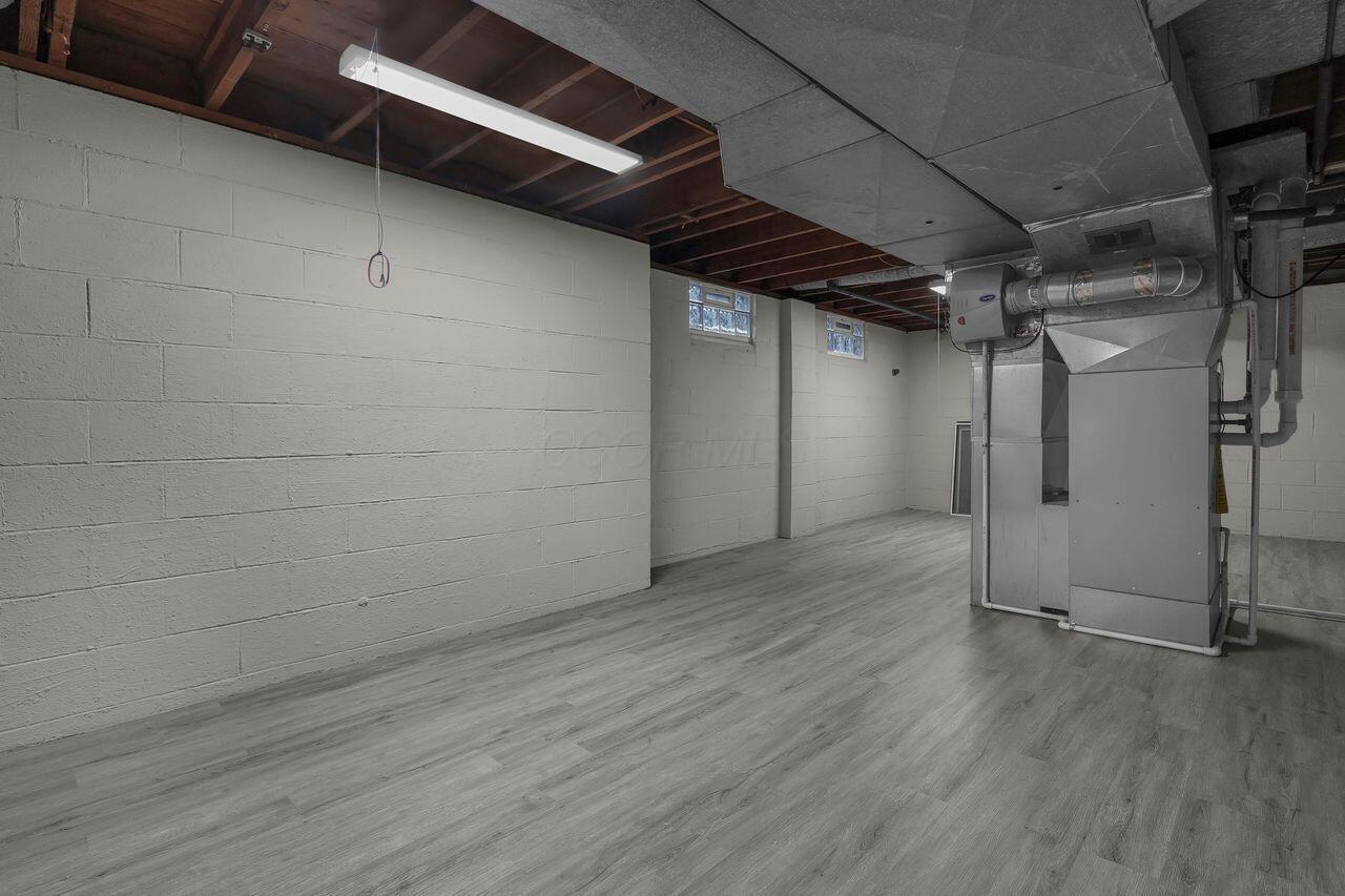 1535 Kenwick Road Columbus, OH 43209 - Photo 20 of 26 Basement utility area with updated flooring, mechanicals, and storage space.