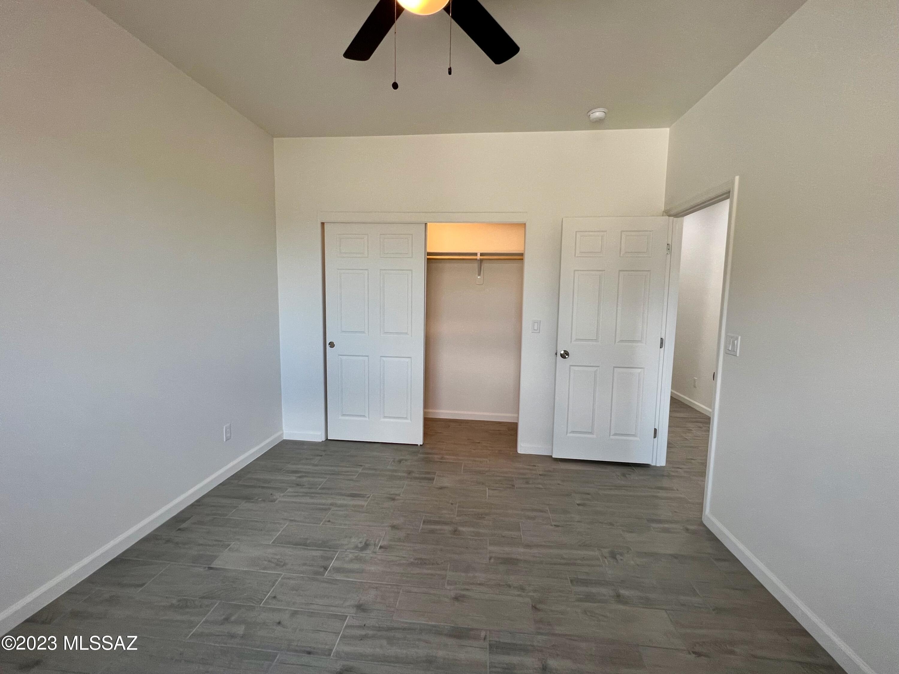 353 Dock Street Rio Rico, AZ 85648 - Photo 34 of 50 an empty room with closet and a chandelier fan