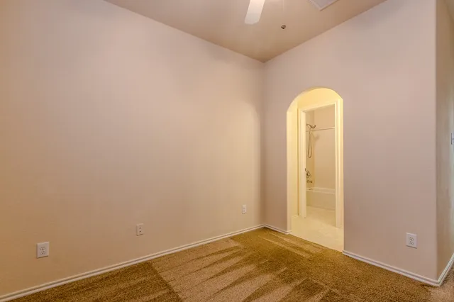 a bathroom with a sink and mirror with toilet
