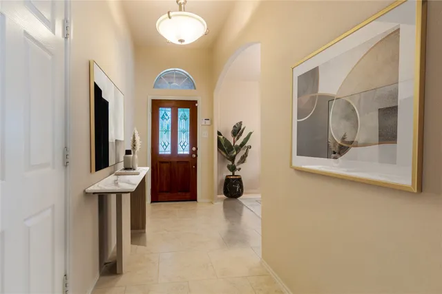 a view of a hallway with front door