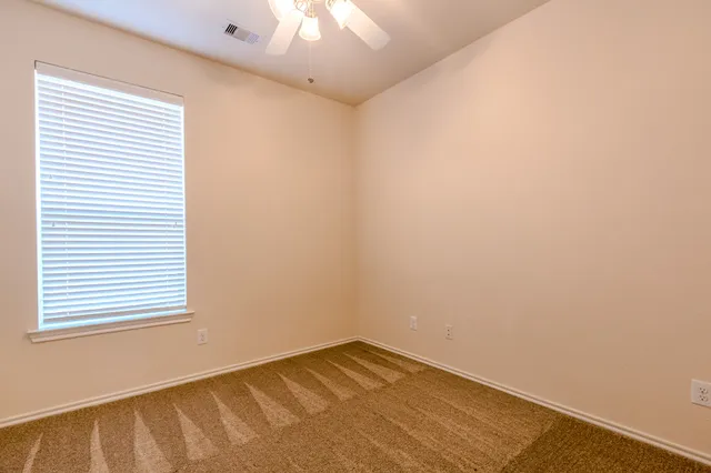 a outdoor living space with furniture and a floor to ceiling window