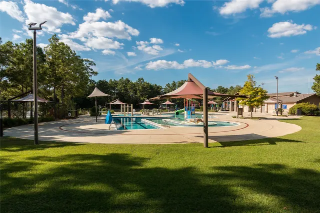 a view of a lake with outdoor space and a lake view in back