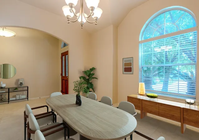 a view of a dining room with furniture window and outside view
