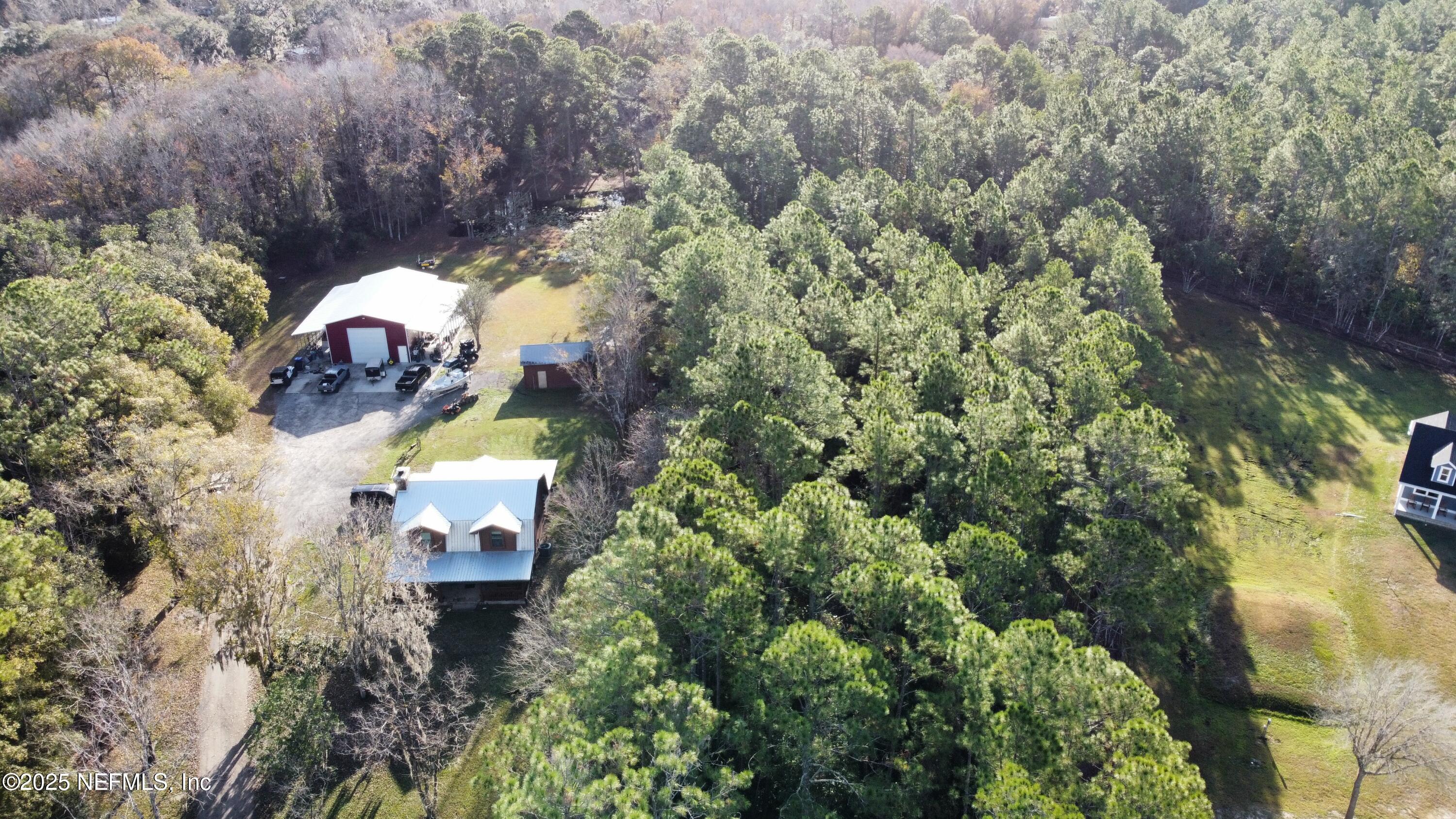 282 Circle Drive East St. Augustine, FL 32084 - Photo 3 of 8 an aerial view of a house with a yard basket ball court and outdoor seating