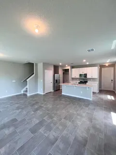 a view of kitchen with furniture and window