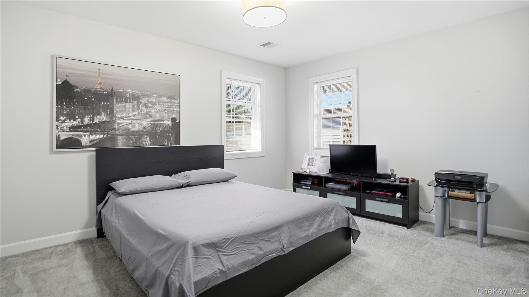 130 Beaver Dam Road Brookhaven, NY 11719 - Photo 20 of 30 Bedroom with light carpet