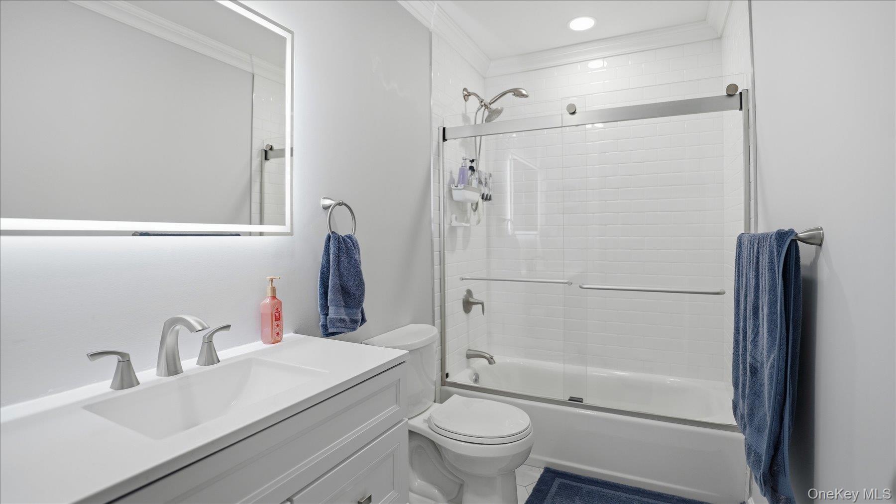 130 Beaver Dam Road Brookhaven, NY 11719 - Photo 24 of 30 Full bathroom with vanity, ornamental molding, combined bath / shower with glass door, and recessed lighting