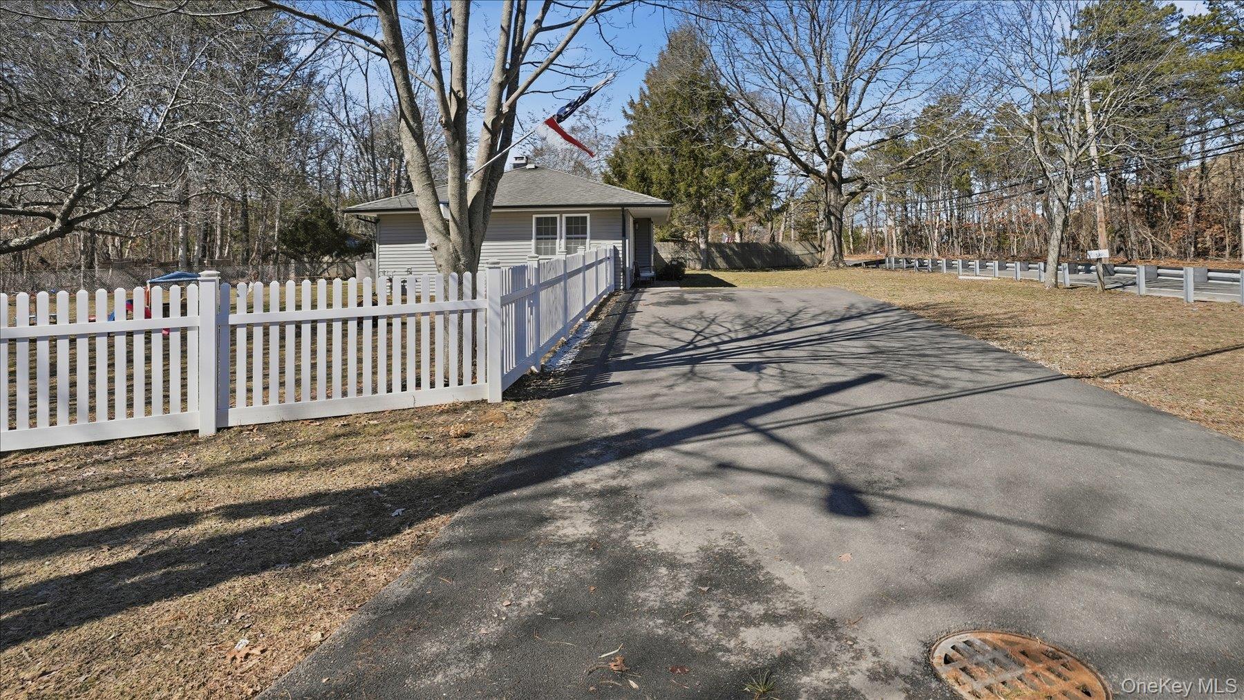 130 Beaver Dam Road Brookhaven, NY 11719 - Photo 5 of 30 View of home's exterior featuring driveway