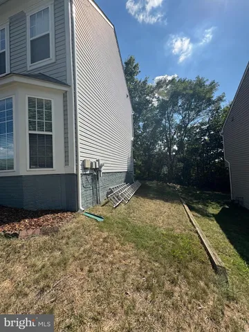 a view of a backyard of the house