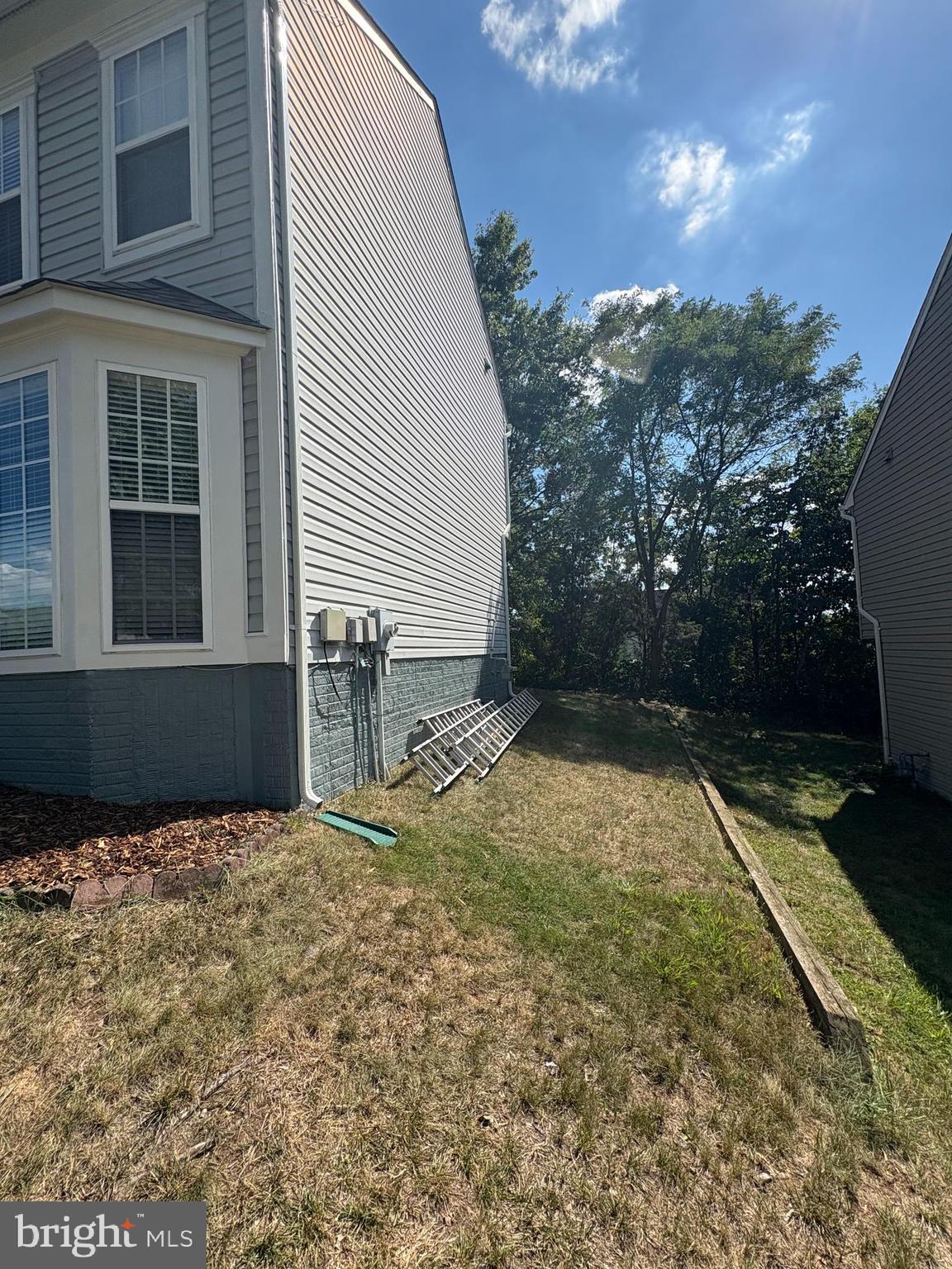 3108 Butterfly Way Dumfries, VA 22026 - Photo 3 of 8 a view of a backyard of the house