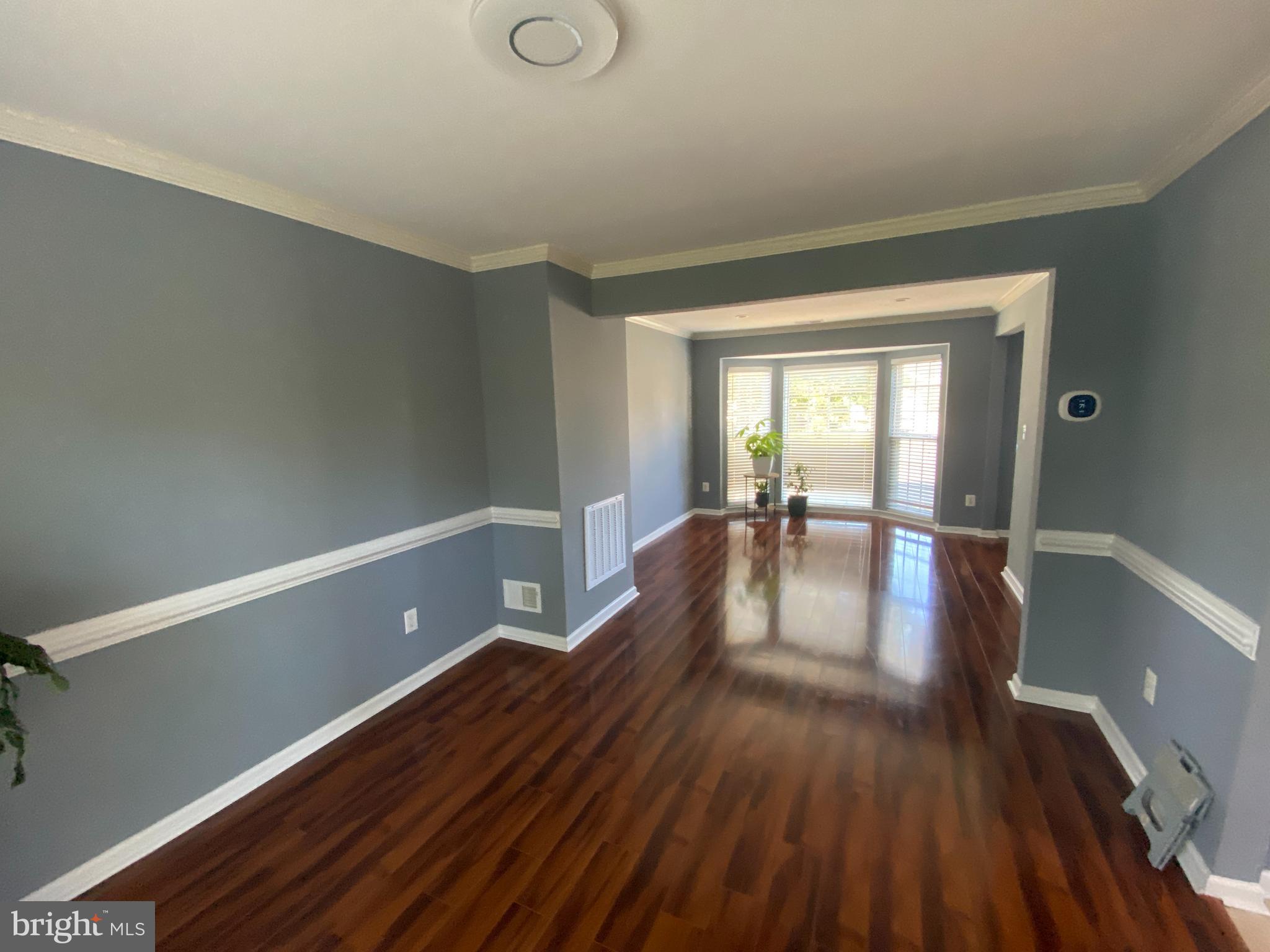 3108 Butterfly Way Dumfries, VA 22026 - Photo 8 of 8 a view of a room with wooden floor and furniture