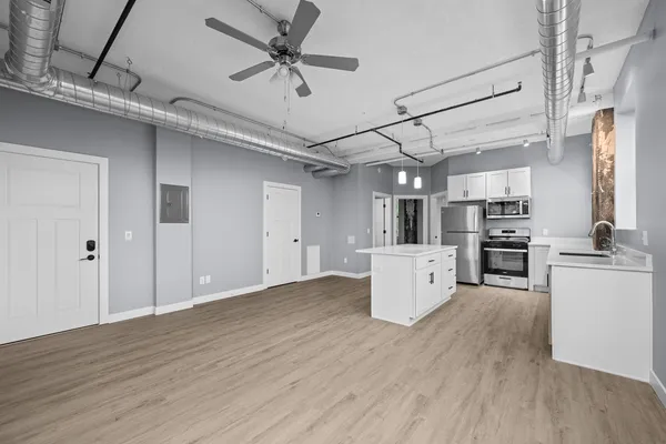 a view of a kitchen with microwave and stove