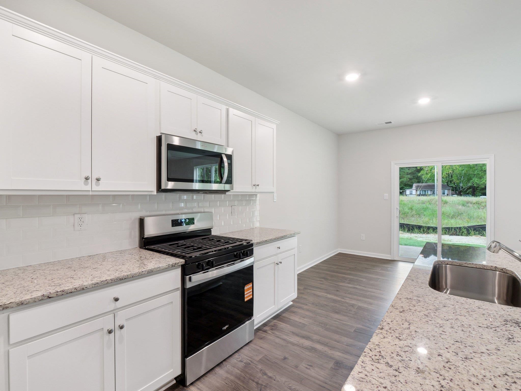 500 Rachel Drive Penn Laird, VA 22846 - Photo 6 of 30 a kitchen with granite countertop a stove a sink and a granite counter tops