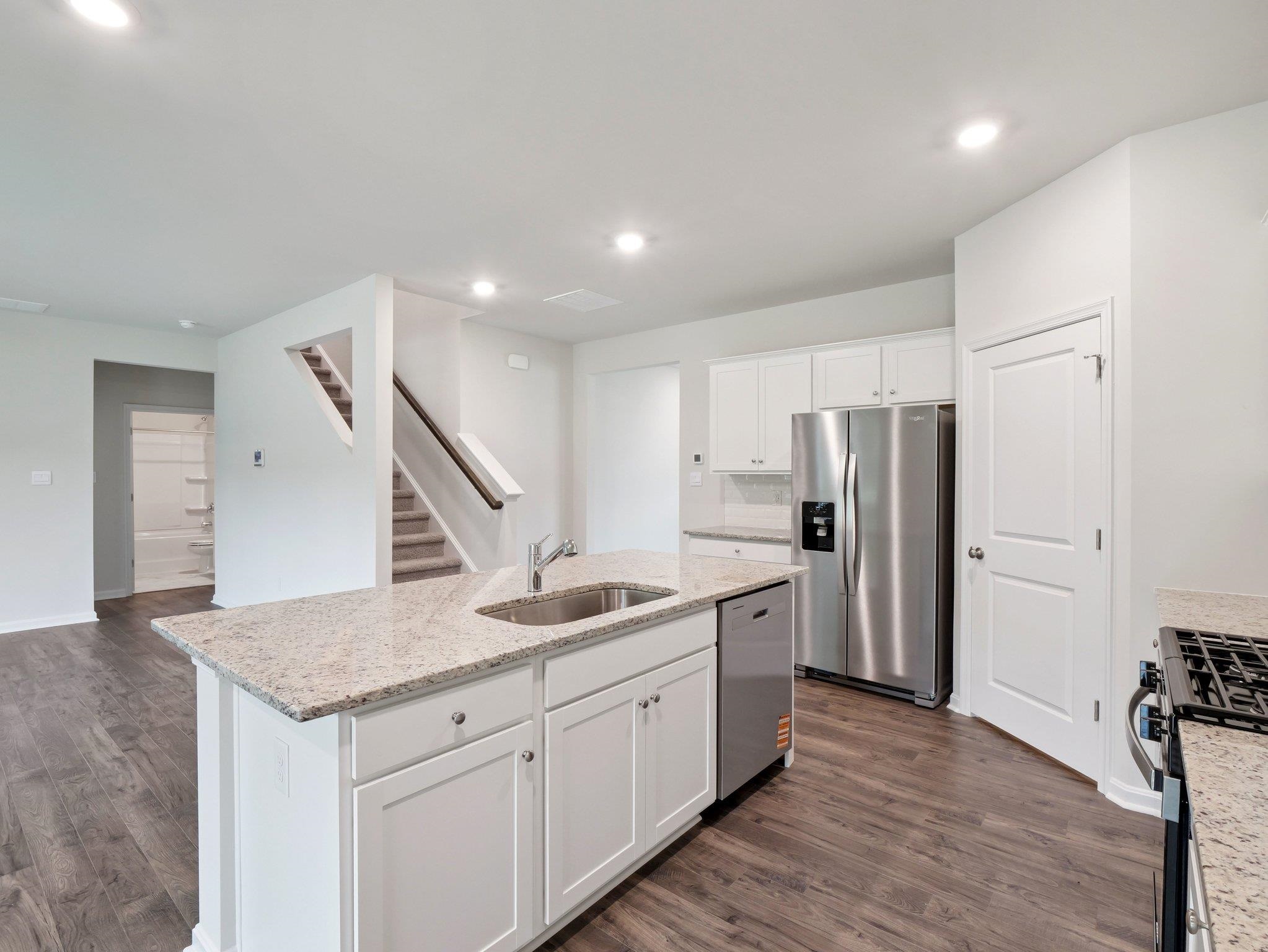 500 Rachel Drive Penn Laird, VA 22846 - Photo 7 of 30 a kitchen with stainless steel appliances granite countertop a sink and a refrigerator