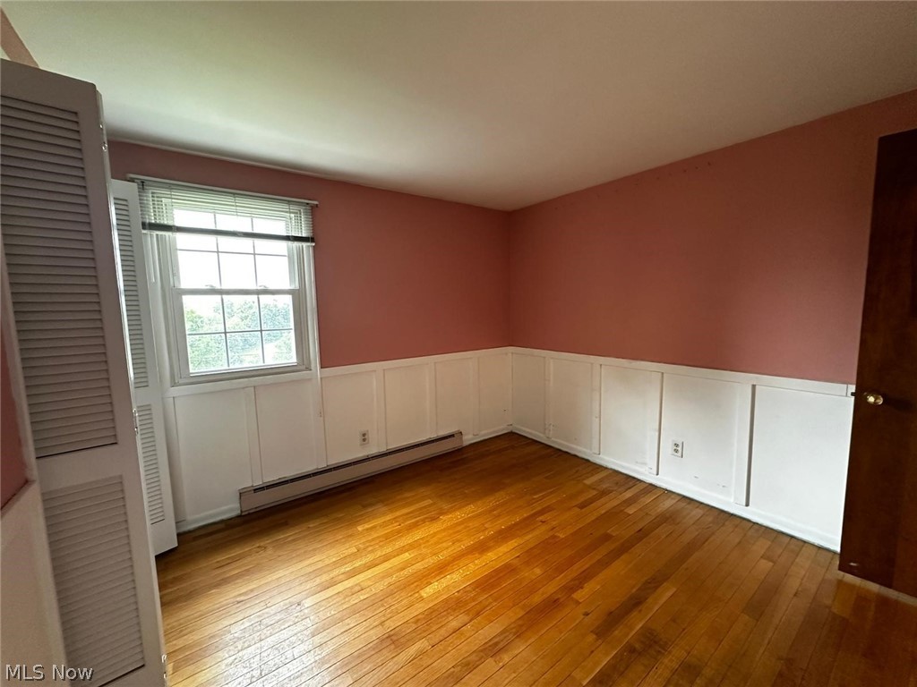 2093 Cambridge Road Coshocton, OH 43812 - Photo 25 of 32 Empty room with a baseboard radiator and light hardwood / wood-style flooring