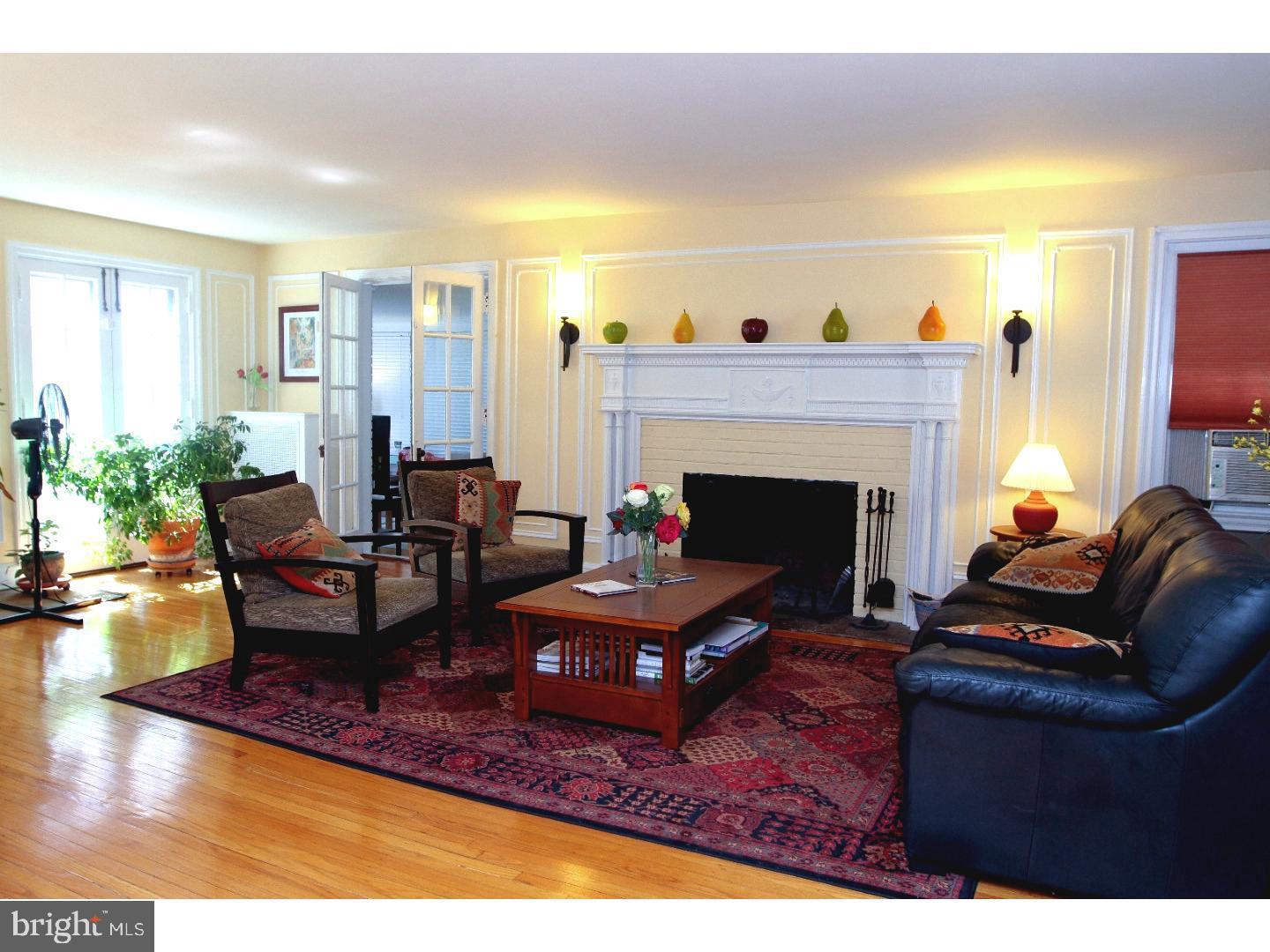 434 Levering Mill Road Merion Station, PA 19066 - Photo 3 of 14 a living room with furniture and a fireplace