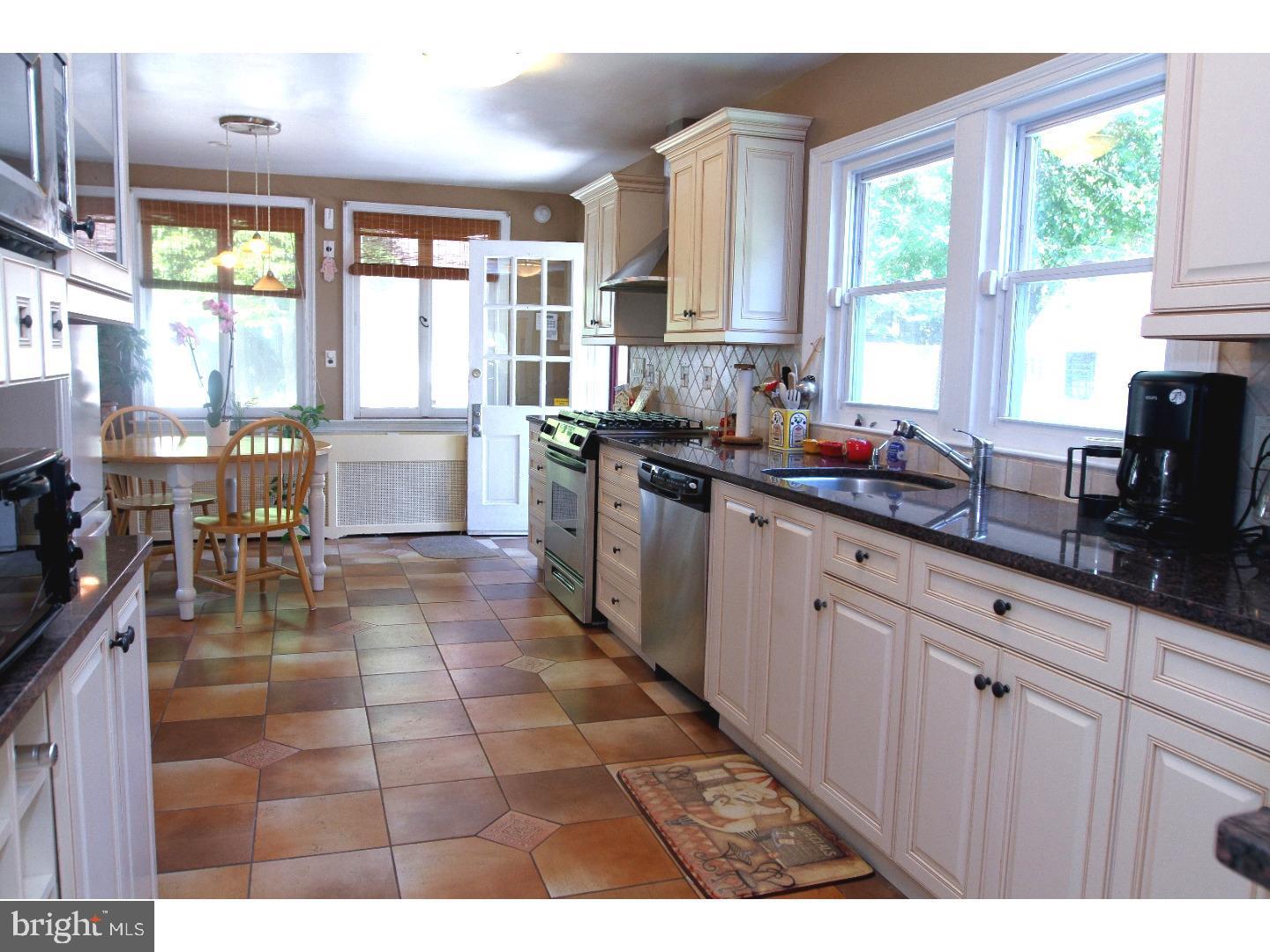 434 Levering Mill Road Merion Station, PA 19066 - Photo 6 of 14 a kitchen with stainless steel appliances a sink counter space and a window