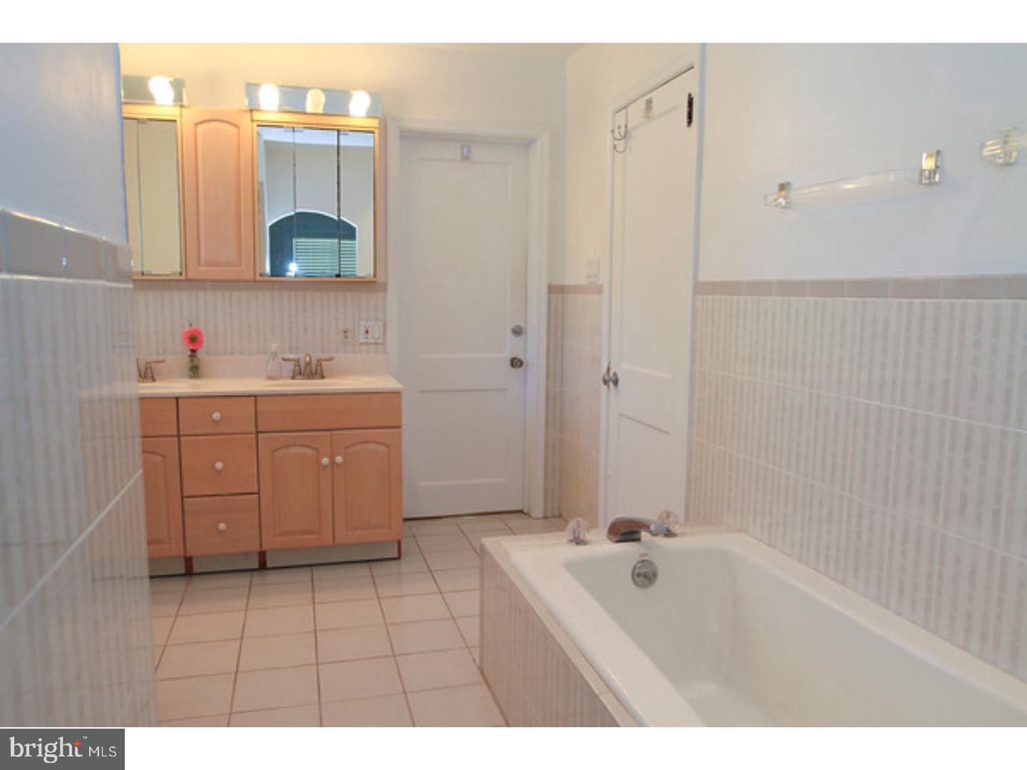 434 Levering Mill Road Merion Station, PA 19066 - Photo 9 of 14 a bathroom with a tub a sink and mirror