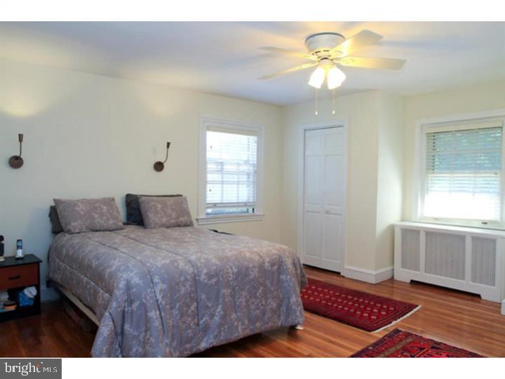 434 Levering Mill Road Merion Station, PA 19066 - Photo 10 of 14 a bedroom with a bed and a chandelier