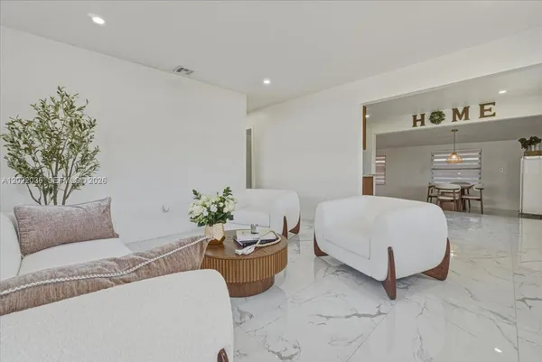 a spacious bedroom with a bed and a couch