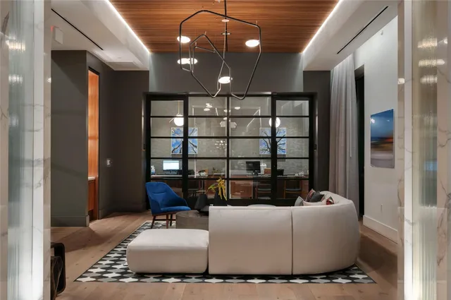 a bedroom with a bed and a wall painting