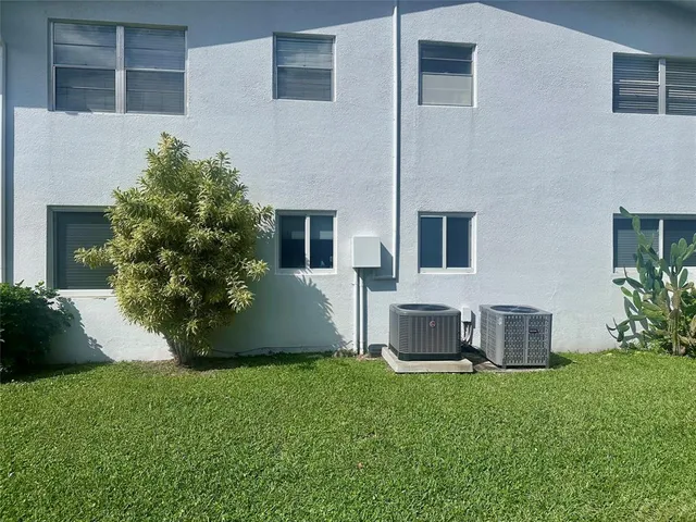 a view of a park with large trees
