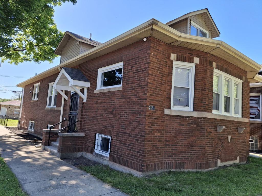 a front view of a house with garage