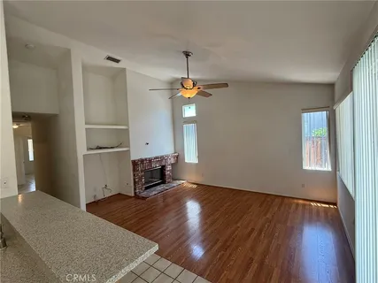 a bedroom with bed and window