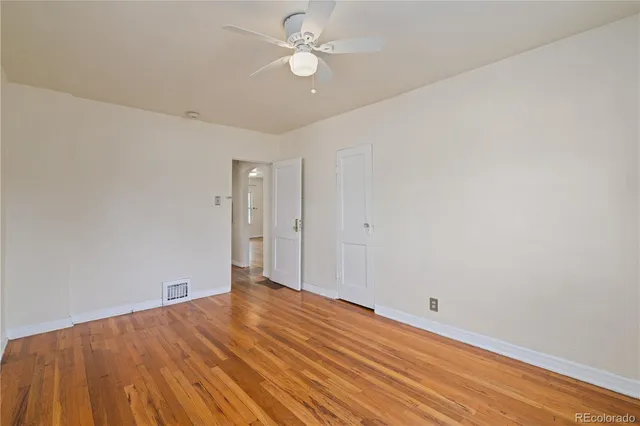 a view of room with window and ceiling fan