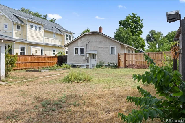 a view of a house with a yard and plants