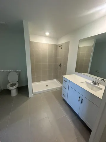 a bathroom with a bathtub sink and toilet