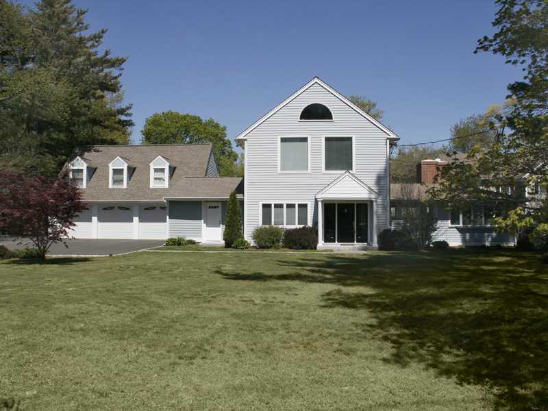 27 Middlesex Road Darien, CT 06820 - Photo 1 of 20 a front view of a house with a garden