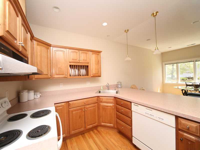 27 Middlesex Road Darien, CT 06820 - Photo 14 of 20 a kitchen with a sink a stove a window and cabinets