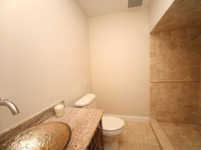 27 Middlesex Road Darien, CT 06820 - Photo 16 of 20 a bathroom with a granite countertop toilet and a sink
