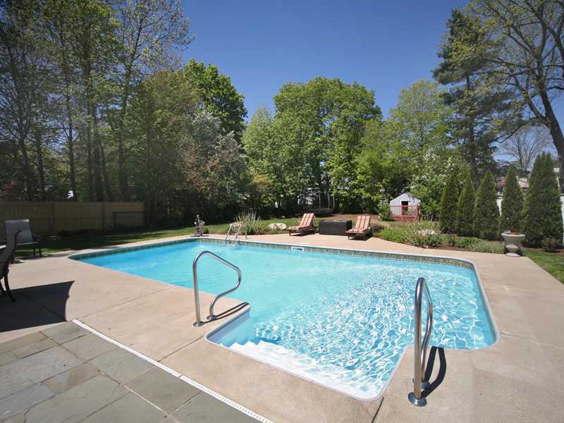 27 Middlesex Road Darien, CT 06820 - Photo 19 of 20 a view of a swimming pool with a patio